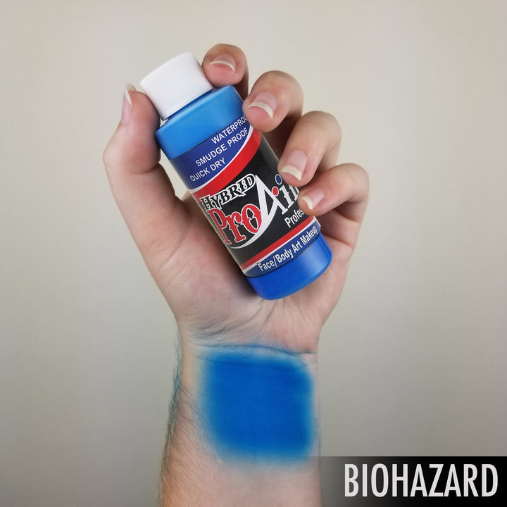 hand holding atomic blue face body airbrush face body paint