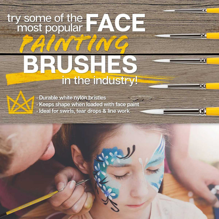 face painting brush used on girl with blue face paint base and white flowers with black curls and swirls