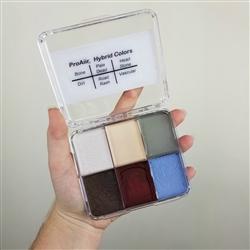 ProAiirHand holding an open Wicked Solids Palettes by Pro Aiir at extrememakeupfx
